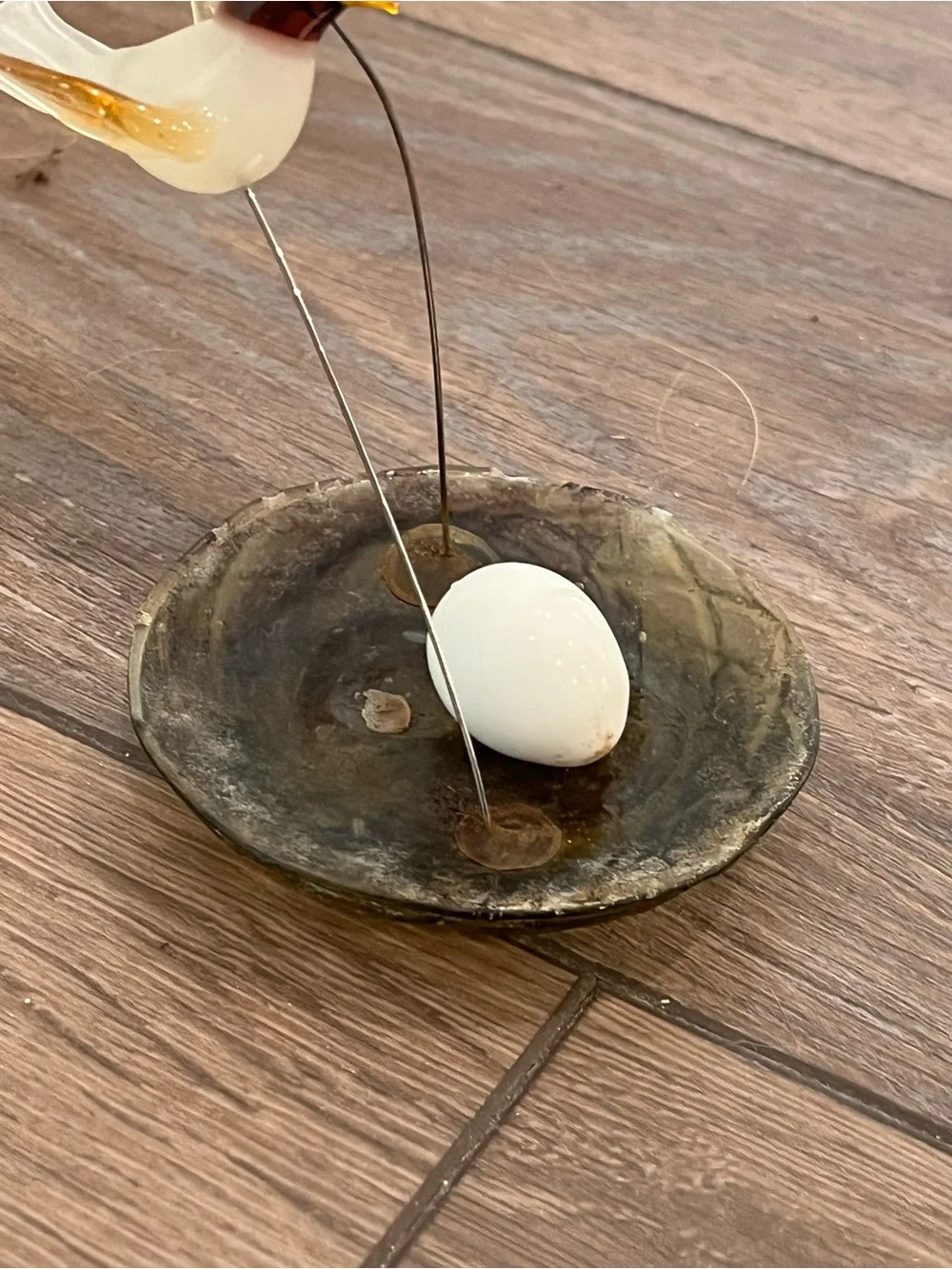 Blown glass bird with nest sculpture